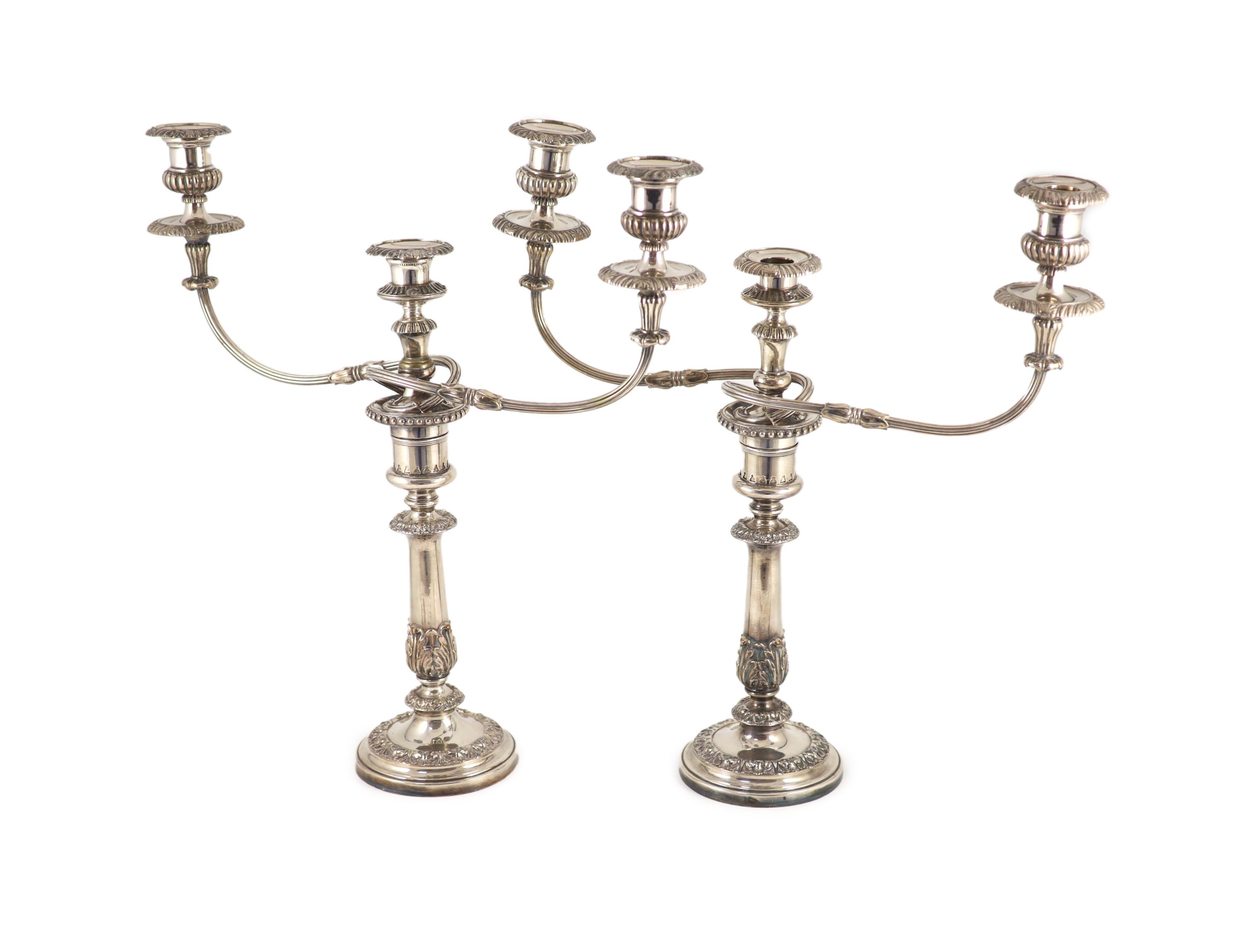 A pair of early to mid 20th century silver plated three light, two branch candelabra